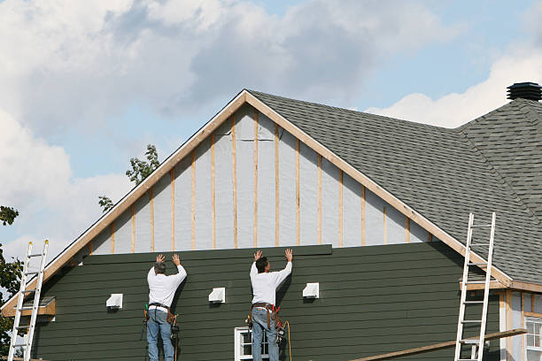 Professional Siding technician working in Milton, FL